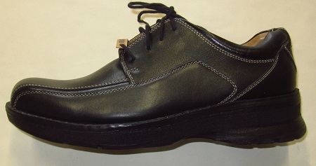 Image of a Docker shoe with a shoe  lift for a person with a leg length discrepancy.